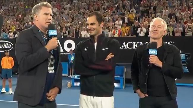 Will Ferrell interviews Roger Federer and John McEnroe on court at Melbourne Park.