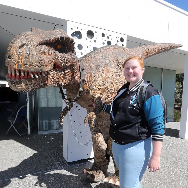 Elise Bundy hangs out with her dinosaur. Picture: Richard Gosling