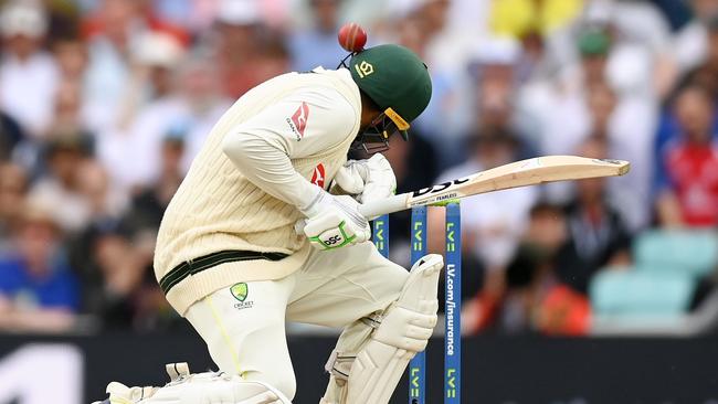 Usman Khawaja is hit on the helmet during Day Four of the 5th Test. Picture: Getty Images.