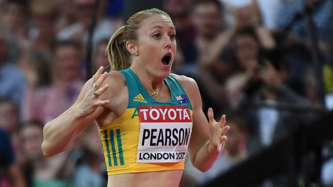 Australia's Sally Pearson celebrates after winning the final of the women's 100m hurdles in London.