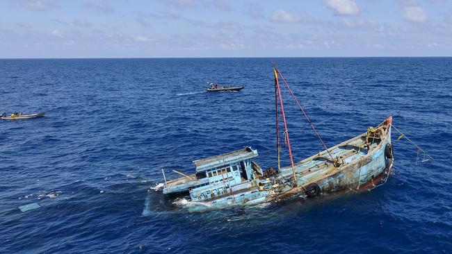 An illegal foreign fishing boat is sunk by Indonesian authorities in Natuna. Picture: Getty Images