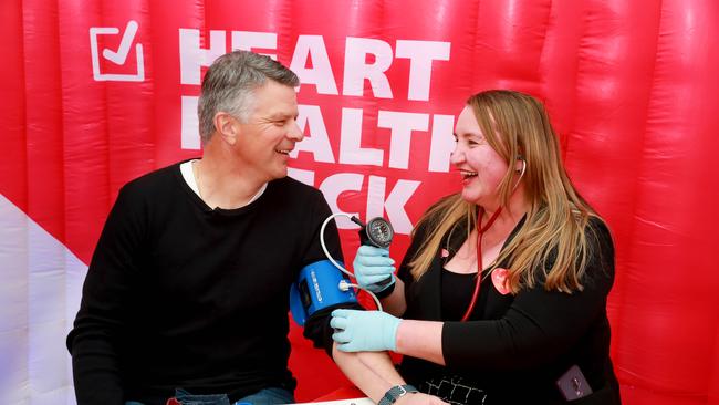 A heart health check tour is making its way across Sydney. PE teacher Chris Minol gets a check by Jayne Baric from the Victor Chang Cardiac Research Institute. Picture: Angelo Velardo