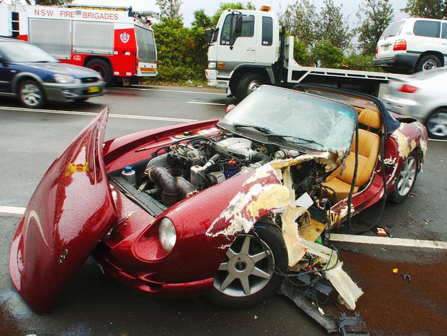 An accident on the Bilgola Bends, at Attunga Rd and Barrenjoey Rd, involving a collision between this sports car and a 4WD in 2006. Picture: Martin Lange