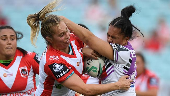 Langi Veainu of the Warriors is tackled by Kezie Apps of the Dragons during the NRL Women's Premiership match between the St George-Illawarra Dragons and the Warriors at ANZ Stadium in Sydney, Saturday, September 15, 2018. (AAP Image/Dan Himbrechts) NO ARCHIVING, EDITORIAL USE ONLY