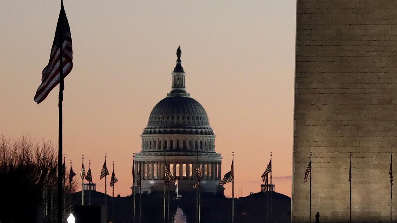 The US Capitol building, centre, and part of the Washington Monument, right, are seen at sunrise, on December 18, 2019, on Capitol Hill in Washington. Picture: AP /Julio Cortez.