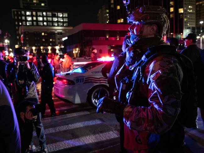 Police stand between Trump supporters and counter protesters in Detroit, Michigan, where violence has erupted. Picture: AFP