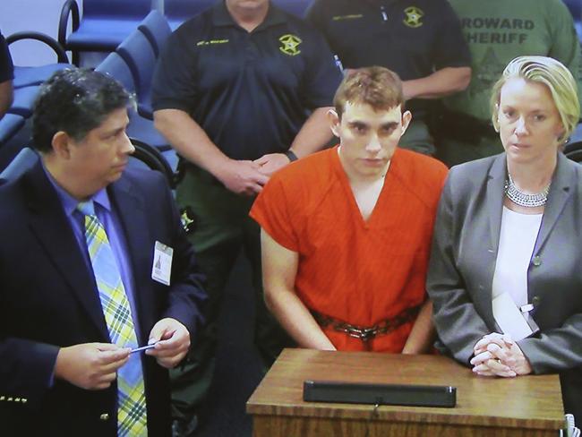 A video monitor shows school shooting suspect Nikolas Cruz making an appearance before Judge Kim Theresa Mollica in Broward County Court. Picture: AP