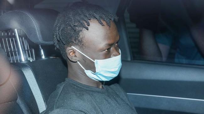 SA Police escort Mathiang Malok back to Adelaide from Melbourne to face charges. Picture: Brenton Edwards