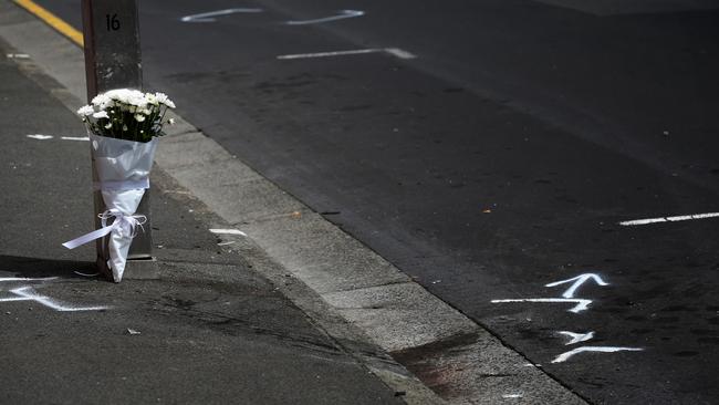 Flowers are left at the crash site of the Fatality involving a pregnant mother and her 2 year old son. on Murray St, Hobart. Picture: SAM ROSEWARNE