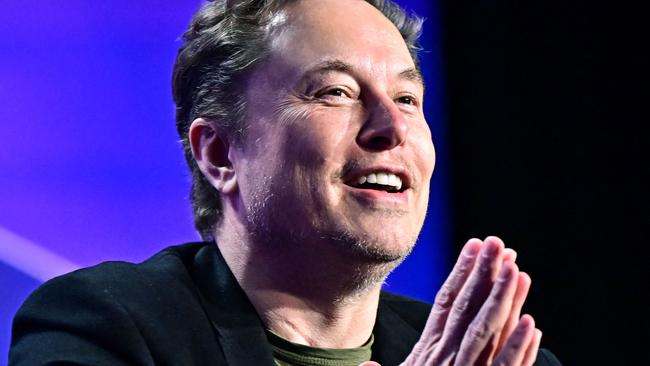 (FILES) Tesla CEO Elon Musk speaks at the 27th annual Milken Institute Global Conference at the Beverly Hilton in Los Angeles on May 6, 2024. Tesla and SpaceX tycoon Elon Musk lashed out June 10, 2024 at a partnership between OpenAI and Apple, saying the threat to data security will make him ban iPhones at his companies. (Photo by Frederic J. BROWN / AFP)