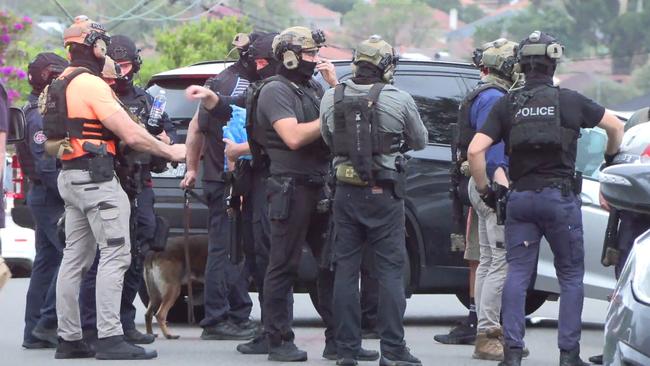 Tactical squads outside the home in Belmore. Picture: News Media Network