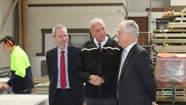 Prime Minister Malcolm Turnbull listens to BP Interior’s Managing Director Oliver vom Bruch while Banks MP David Coleman looks on.