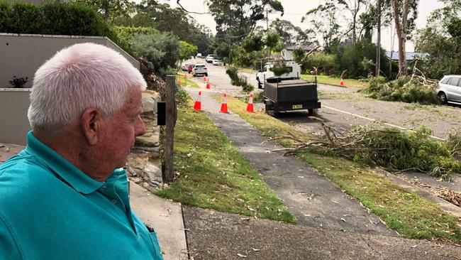 Ian Gurney looks at his damage Ute, after an 11,000 volt powerline fell on it during a storm. Picture: Jim O'Rourke.