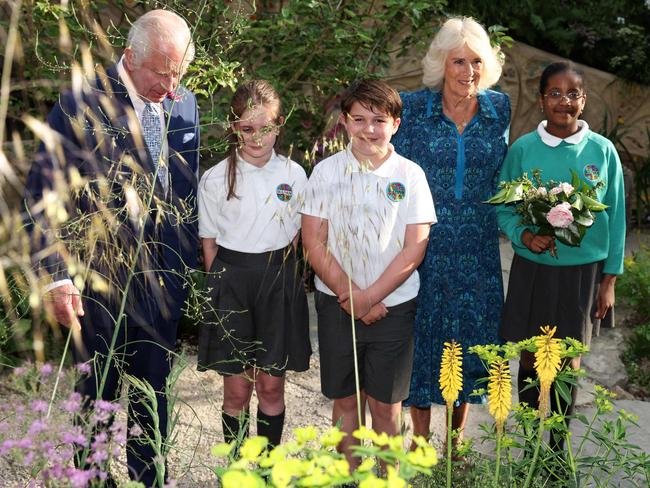 King Charles III and Queen Camilla meet with pupils of the Sulivan Primary school as they visit the No Adults Allowed Garden. Picture: AFP