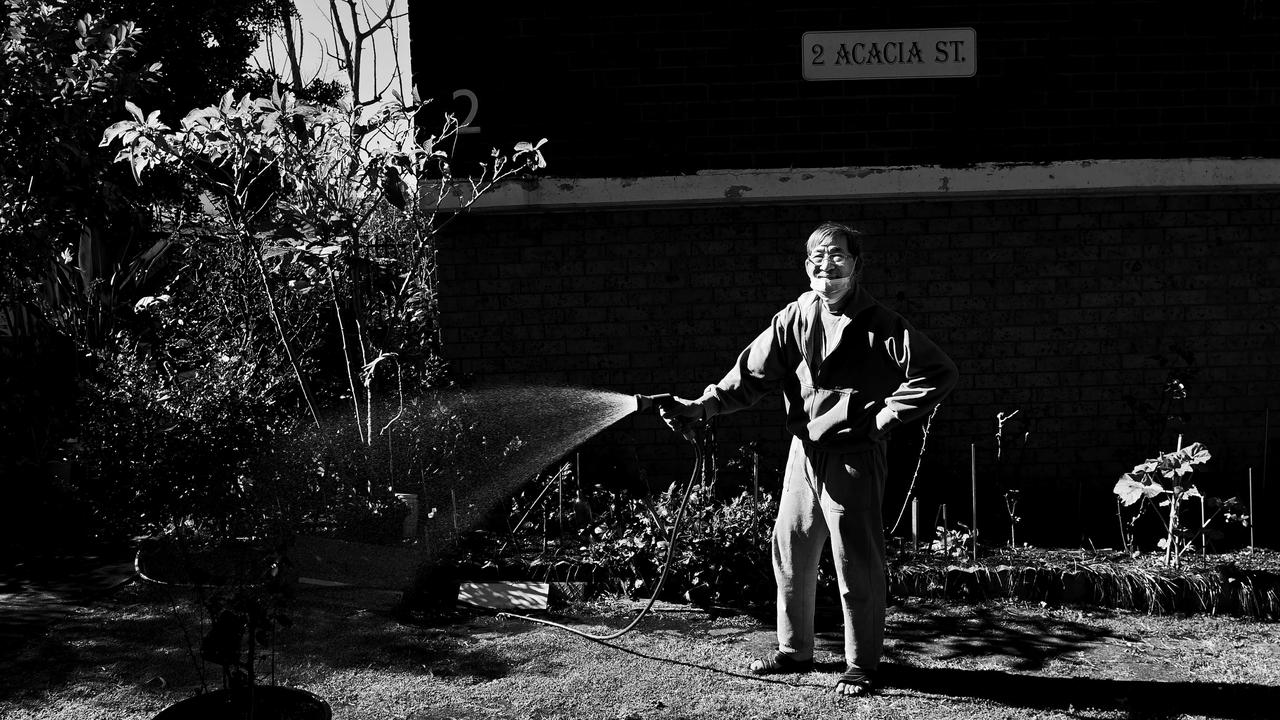 Quang Nguyen, 75 years old, waters his garden in Cabramatta. Picture: Jeremy Piper