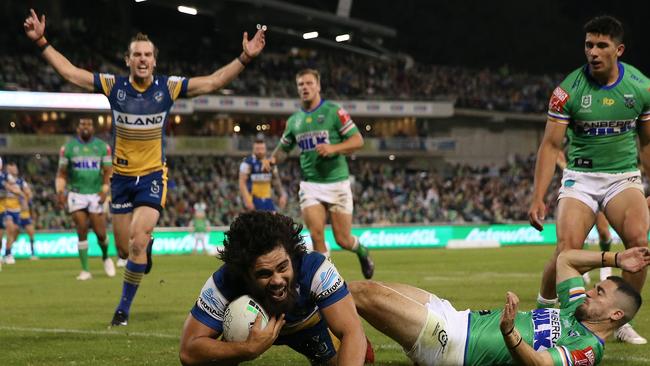 CANBERRA, AUSTRALIA - APRIL 17:  Isaiah Papali'i of the Eels celebrates with team mates after scoring a try during the round six NRL match between the Canberra Raiders and the Parramatta Eels at GIO Stadium on April 17, 2021, in Canberra, Australia. (Photo by Matt Blyth/Getty Images)