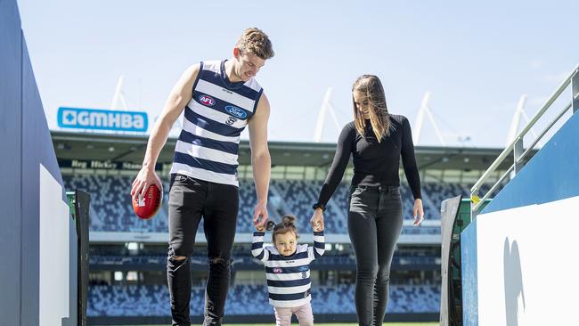 Josh Jenkins poses for a photograph with his wife Hannah, and daughter Lottie, after officially arriving at the Cattery. Picture: Getty Images