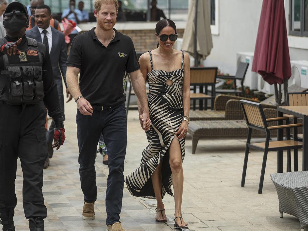 Harry and Meghan at a volleyball match at Nigeria Unconquered, a local charity organisation that supports wounded, injured, or sick servicemembers, in Abuja on May 11. Picture: Kola Sulaimon / AFP