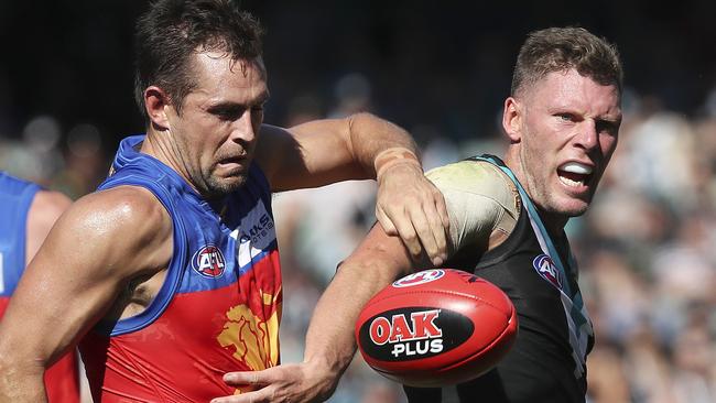 Brad Ebert fends off Luke Hodge. Picture: Sarah Reed