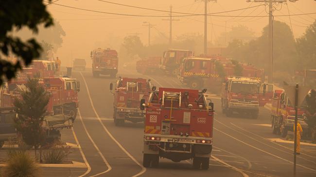 Fire fleet: CFA trucks gathered to defend Corryong, as volunteers demand $200m to upgrade their ageing trucks. Picture: Jason Edwards