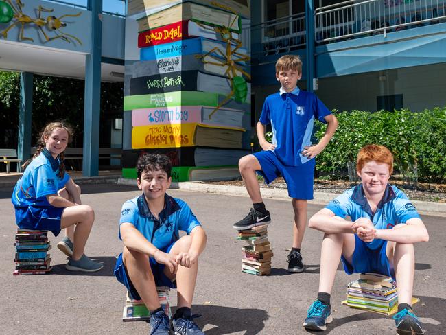 Local Artists Proper Creative have helped colour up Stuart Park Primary with a new book stack mural on one of the stairwells. Chloe Warthold,  Peter Diamandopoulos, Oscar Collins and Ralph Stephens sit on their own book stacks.Picture Che Chorley