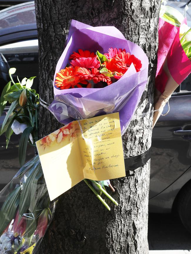 A flower memorial at the scene of the crash. Picture: David Crosling