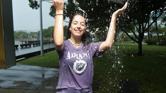 Chiara Garraffo enjoyed a change in the weather after being caught in a downpour on the Cairns Esplanade on Sunday. Picture: Peter Carruthers