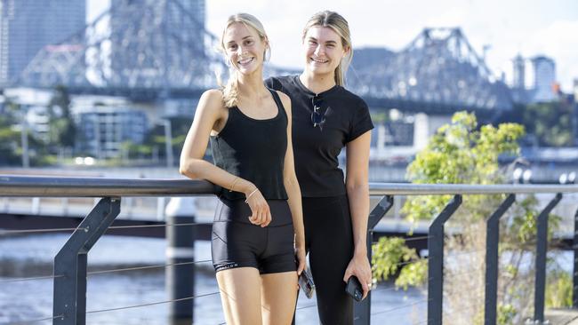 Bella McGrath and Charlotte Baker enjoy Brisbane’s Riverwalk at New Farm. Picture: Richard Walker