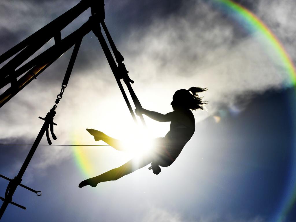 Aerialist Ashley Winn, of Johnny Rockett's Cycle Circus Live Show, performs for the crowd at the Heart of Illinois Fair, Tuesday, July 17, 2018, in Peoria, Ill. (Ron Johnson/Journal Star via AP)