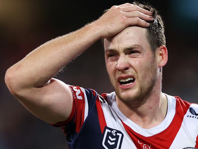 SYDNEY, AUSTRALIA - JUNE 11: Luke Keary of the Roosters holds his head as he leaves the field for an Head Injury Assessment  during the round 14 NRL match between the Sydney Roosters and the Melbourne Storm at Sydney Cricket Ground, on June 11, 2022, in Sydney, Australia. (Photo by Mark Kolbe/Getty Images)