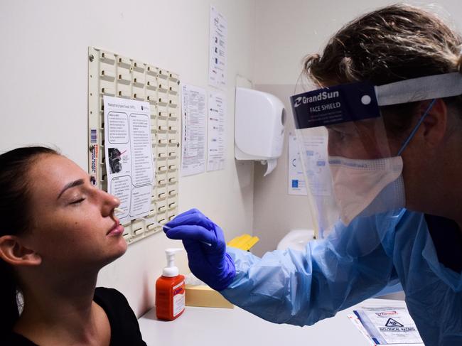 A supplied image obtained on Wednesday, April 1, 2020, shows a woman being tested for Coronavirus (COVID-19) at St Vincent's Hospital in Sydney. The number of confirmed cases in NSW on Wednesday grew to 2182, with a 95-year-old woman becoming the ninth COVID-19 death in the state and the 20th death nationwide. (AAP Image/Supplied by St Vincent's Hospital) NO ARCHIVING, EDITORIAL USE ONLY