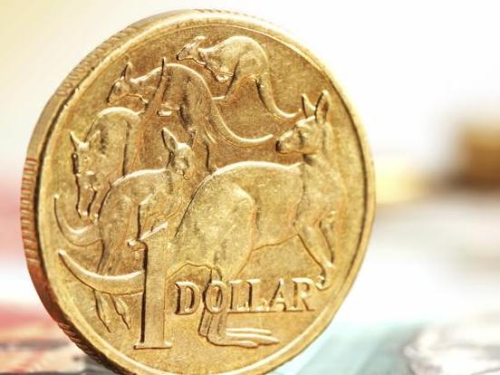 Aussie one dollar coins, on a twenty dollar note.