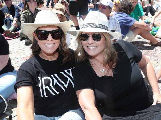 Sisters Anna Stiles and Miffy Stiles brave the heat to watch Robbie Williams’ free concert. Picture: David Crosling