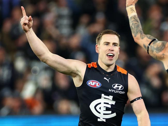 MELBOURNE, AUSTRALIA – JUNE 21: Matthew Owies of the Blues celebrates kicking a goal with Zac Williams of the Blues during the round 15 AFL match between Carlton Blues and Geelong Cats at Melbourne Cricket Ground, on June 21, 2024, in Melbourne, Australia. (Photo by Quinn Rooney/Getty Images)