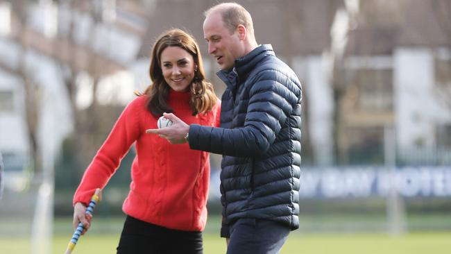 Prince William and Catherine play hurling during a visit to Galway on their trip to Ireland. Picture: AAP