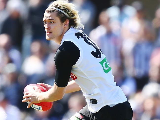 MELBOURNE, AUSTRALIA - SEPTEMBER 27:  Darcy Moore of the Magpies runs with the ball during a Collingwood Magpies AFL training session at Holden Centre on September 27, 2018 in Melbourne, Australia.  (Photo by Michael Dodge/Getty Images)