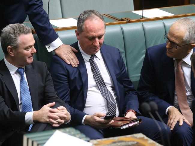 Scott Bucholz pats  Deputy PM Barnaby Joyce on the shoulder during a vote on a censure motion brought on by Labor to censure the Deputy PM Barnaby Joyce, in the House of Representatives Chamber at Parliament House in Canberra. Picture Kym Smith