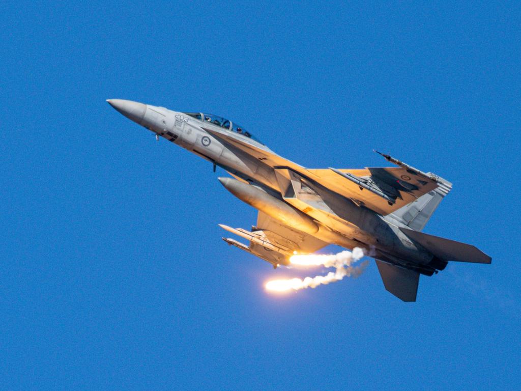 A RAAF Super Hornet does a flare drop opening the inaugural Pacific Air Show over Surfers Paradise. Picture: Supplied