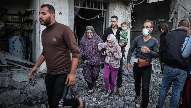 People flee following an Israeli strike in Rafah in the southern Gaza Strip on November 23 amid ongoing battles between Israel and the Palestinian militant group Hamas. Picture: Mohammed Abed/AFP