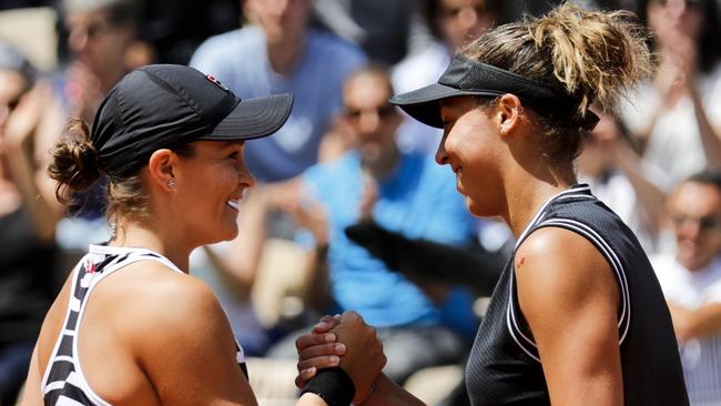 Ash Barty (left) shakes hands with Madison Keys after winning their French Open quarter-final. Picture: AFP