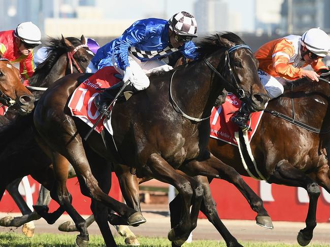 Corey Brown sends Kentucky Breeze to the front to win the final race of the four-day Flemington Spring Carnival. Picture: Getty Images