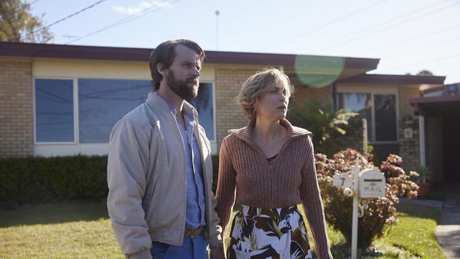 Tony Bissett (Jesse Spencer) and wife Judy (Radha Mitchell) in Last Days of the Space Age, Disney+