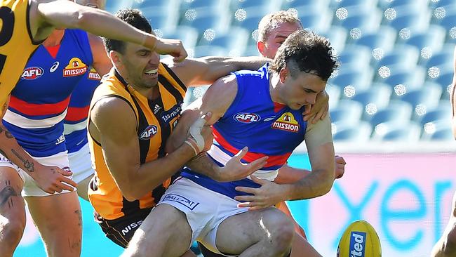 Moments from tragedy as McLean is tackled by Hawk giant Jonathon Ceglar. Picture: Getty Images