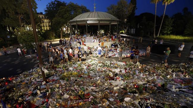 Mourners left floral tributes, notes and candles for victims of the deadly Bastille Day attack in Nice, southern France. Picture: AFP/Valery Hache