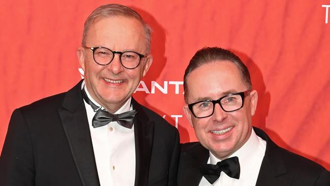 SYDNEY, AUSTRALIA - MARCH 31: Australian Prime Minister Anthony Albanese (L) stands with Qantas CEO Alan Joyce as they attend the Qantas 100th Gala Dinner at Jetbase 96 hangar at Sydney's International Airport on March 31, 2023 in Sydney, Australia. (Photo by James D. Morgan/Getty Images)