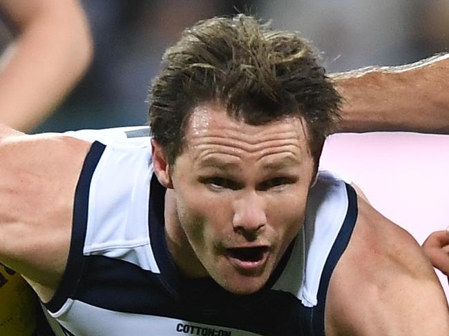 Patrick Dangerfield of the Cats (left) and Alex Neal-Bullen of the Demons contest during the Round 2 AFL match between the Geelong Cats and the Melbourne Demons at GMHBA Stadium in Geelong, Saturday, March 30, 2019. (AAP Image/Julian Smith) NO ARCHIVING, EDITORIAL USE ONLY