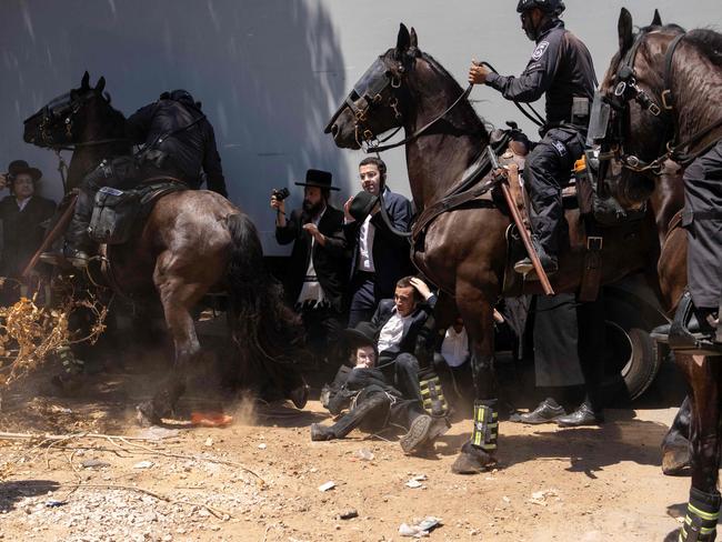 Israeli mounted police deploy as ultra-Orthodox protesters demonstrate in Tel Aviv on the first day religious Jewish men were requested to enlist for compulsory military service. Picture: AFP