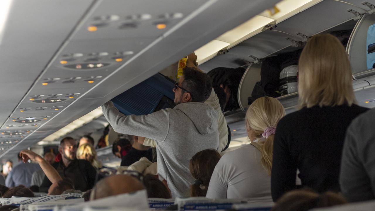 It’s meant to be one piece of luggage per passenger in the overhead locker. Picture: iStock