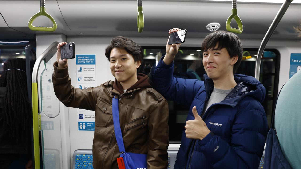 Pictured is Leo Player and Eason Wang who were among the first passengers who boarded at Sydenham Station on the brand new Sydney Metro on its maiden run to Tallawong at 4.54am. Picture: Richard Dobson