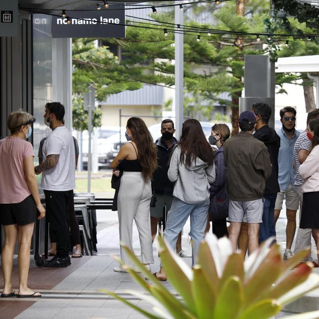 Day 2 in lockdown. Members of the public line up to get coffee in Broadbeach. Picture: Tertius Pickard